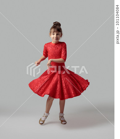 Dancing girl in a red dress. 101104084