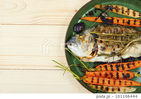 Roasted gilthead fish, space for text 101106444