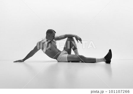 Handsome young muscular man posing shirtless over studio background. Masculinity and strength 101107266
