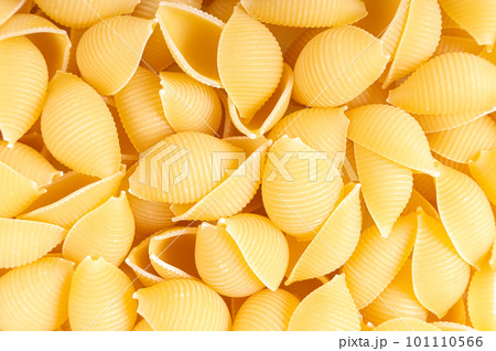 Raw pasta conchiglioni spaghetti pattern. Food background, italian cuisine 101110566