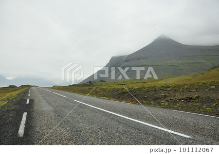 Coastal road in Iceland leading through mountains Coastal road in Iceland leading through mountains 101112067