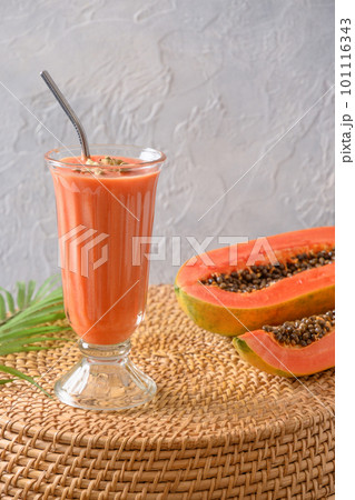 Papaya lassi or smoothie on gray background. 101116343