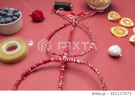 Survakane, Survachka, Surva. Top View Cornel Stick With Decorations, Dry Fruits, Threads, Ribbon, Popcorn. Bulgarian Tradition Of Clapping Each Other For Happiness, Health. Flatly, Horizontal plane Survakane, Survachka, Surva. Top View Cornel Stick With Decorations, Dry Fruits, Threads, Ribbon, Popcorn. Bulgarian Tradition Of Clapping Each Other For Happiness, Health. Flatly, Horizontal plane 101117071