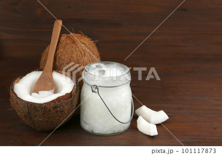 Composition with organic coconut oil on wooden table. Healthy cooking Composition with organic coconut oil on wooden table. Healthy cooking 101117873