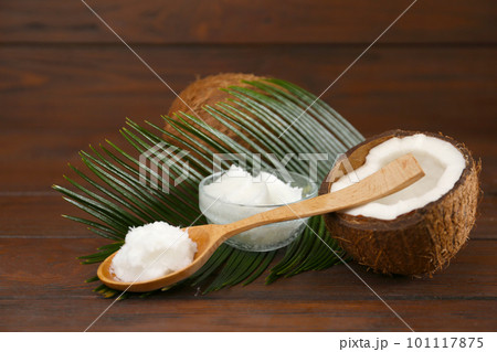 Composition with organic coconut oil on wooden table. Healthy cooking Composition with organic coconut oil on wooden table. Healthy cooking 101117875