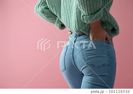 Woman wearing jeans on pink background, closeup. Space for text Woman wearing jeans on pink background, closeup. Space for text 101118310
