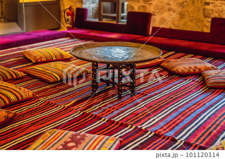 Turkish traditional antique carpets interior. table and pillows Turkish traditional antique carpets interior. table and pillows 101120314
