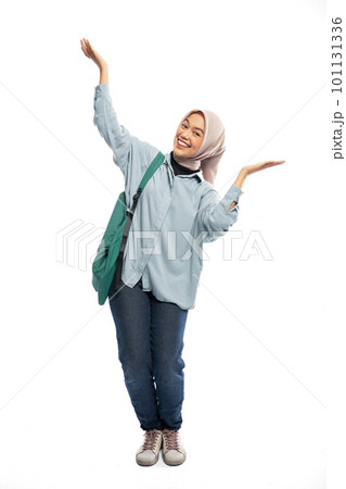 Muslim female university student offering something on top in isolated 101131336