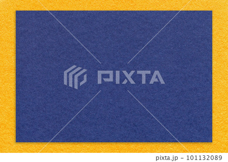 Texture of craft navy blue color paper background with yellow border, macro. Vintage dense kraft denim cardboard Texture of craft navy blue color paper background with yellow border, macro. Vintage dense kraft denim cardboard 101132089