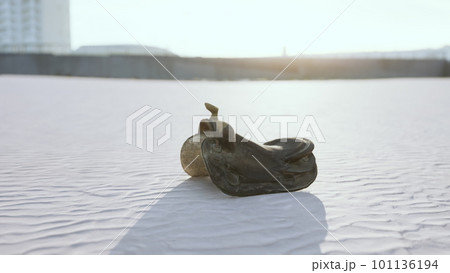 old horse saddle on the beach 101136194