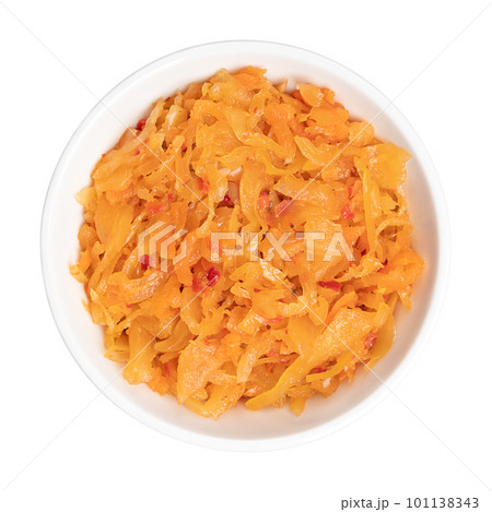 Kimchi, in a white bowl. Traditional Korean side dish, made of salted and fermented vegetables cabbage, carrots, radish and onions, seasoned with garlic, ginger and the Korean chili powder gochugaru. Kimchi, in a white bowl. Traditional Korean side dish, made of salted and fermented vegetables cabbage, carrots, radish and onions, seasoned with garlic, ginger and the Korean chili powder gochugaru. 101138343