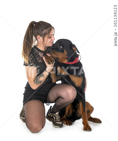 rottweiler and woman in studioの写真素材 [101139123] - PIXTA