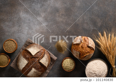 Wholegrain and hemp bread on brown background. Wholegrain and hemp bread on brown background. 101140830