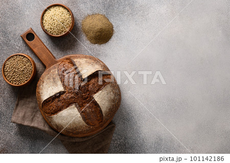 Healthy hemp bread and hemp kernels on gray. Healthy hemp bread and hemp kernels on gray. 101142186