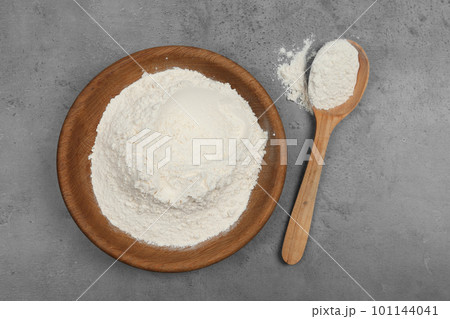 Flour on light grey background, flat lay Flour on light grey background, flat lay 101144041