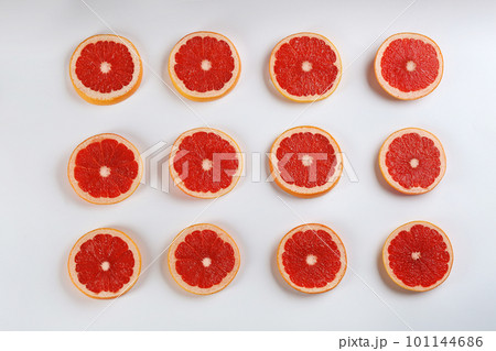 Flat lay composition with tasty ripe grapefruit slices on white background 101144686