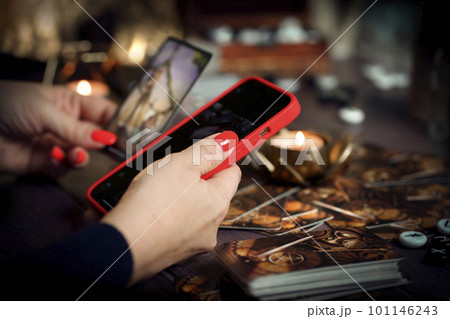 Blurred tarot cards on the table, esoteric concept, fortune telling predictions 101146243