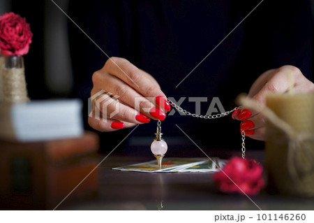 Blurred tarot cards on the table, esoteric concept, fortune telling predictions 101146260