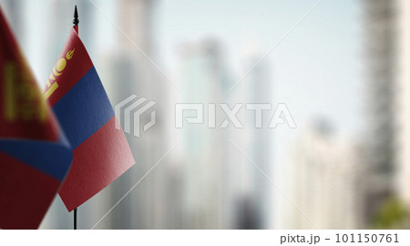 Small flags of the Mongolia on an abstract blurry background 101150761