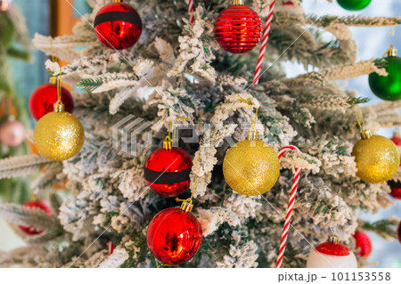 Red and gold Christmas balls decorate the tree to celebrate Christmas and New Year. Soft and select focus copy space background. Red and gold Christmas balls decorate the tree to celebrate Christmas and New Year. Soft and select focus copy space background. 101153558