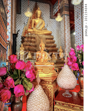Gallery with old vessels of the seated Buddha in the Buddhist temple Wat Arun. Bangkok, Thailand Gallery with old vessels of the seated Buddha in the Buddhist temple Wat Arun. Bangkok, Thailand 101154844