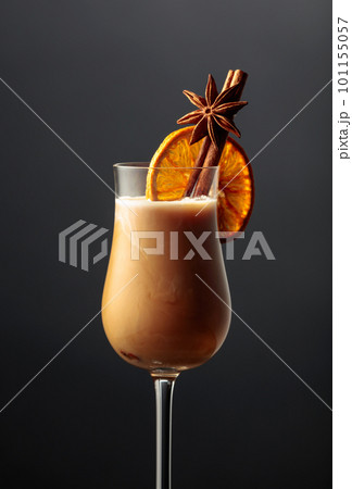 Irish cream coffee liqueur with cinnamon, anise, and a dried orange slice. Irish cream coffee liqueur with cinnamon, anise, and a dried orange slice. 101155057