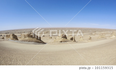 Aerial view of landscape in desert under blue sky Aerial view of landscape in desert under blue sky 101159315