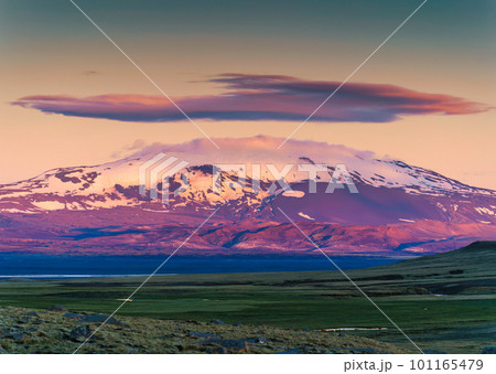 Colorful volcanic mountain with cap cloud among the Icelandic Highlands on summer at Iceland 101165479