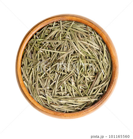 Dried rosemary leaves in a wooden bowl. Salvia rosmarinus, an aromatic and evergreen shrub, with fragrant and needle-like, green leaves, used as a medicinal and culinary herb. Close up, from above. Dried rosemary leaves in a wooden bowl. Salvia rosmarinus, an aromatic and evergreen shrub, with fragrant and needle-like, green leaves, used as a medicinal and culinary herb. Close up, from above. 101165560