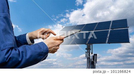 Engineer with tablet computer on a background of solar energy power station 101166824