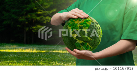 Woman holds a green planet Earth. Woman holds a green planet Earth. 101167913