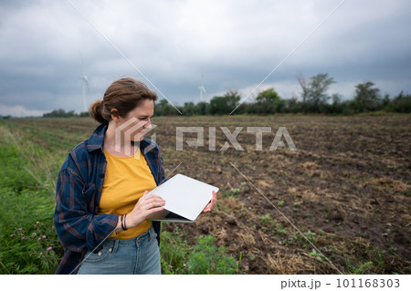 Farmer with laptop on the field. Farmer with laptop on the field. 101168303