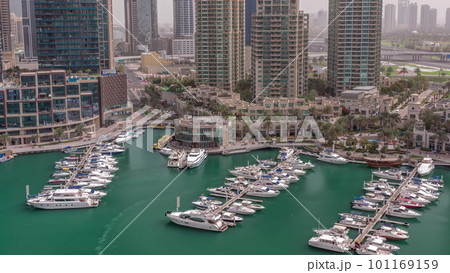 Luxury yacht bay in the city aerial timelapse in Dubai marina Luxury yacht bay in the city aerial timelapse in Dubai marina 101169159