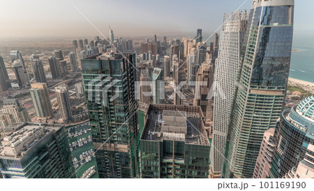 Panorama showing Dubai Marina and JLT with JBR district. Ttraffic on highway between skyscrapers aerial timelapse. 101169190