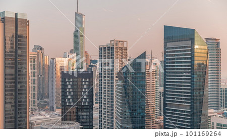 Dubai Marina Skyline with JLT district skyscrapers on a background aerial timelapse. Dubai Marina Skyline with JLT district skyscrapers on a background aerial timelapse. 101169264