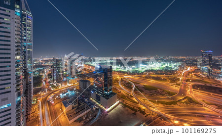 Aerial view of media city and al barsha heights district area day to night timelapse from Dubai marina. Aerial view of media city and al barsha heights district area day to night timelapse from Dubai marina. 101169275