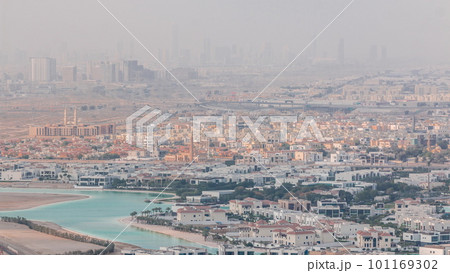 Aerial view of many apartment houses in Dubai city from above timelapse 101169302