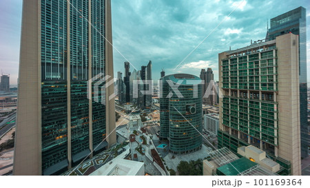 Dubai international financial center skyscrapers aerial night to day timelapse. 101169364