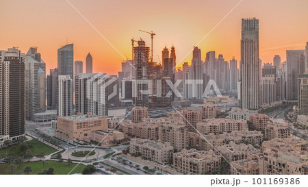 Dubai's business bay towers at sunset aerial timelapse. Rooftop view of some skyscrapers Dubai's business bay towers at sunset aerial timelapse. Rooftop view of some skyscrapers 101169386