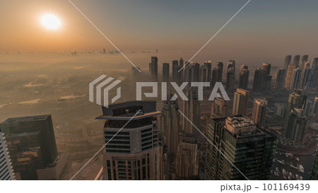 Panorama of Dubai Marina with JLT skyscrapers and golf course during sunrise timelapse, Dubai, United Arab Emirates. 101169439