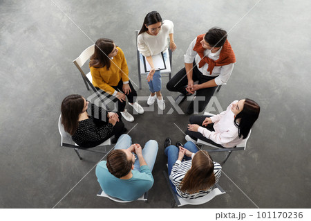 Psychotherapist working with patients in group therapy session, top view Psychotherapist working with patients in group therapy session, top view 101170236