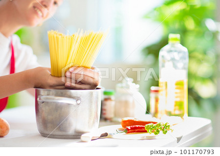 Woman cooking dinner. Cook spaghetti 101170793
