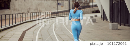Beautiful fit caucasian woman is doing exercises outdoors at the city Beautiful fit caucasian woman is doing exercises outdoors at the city 101172061