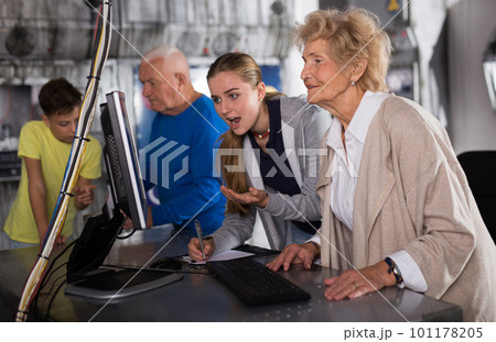 Positively minded family together solve puzzles in a quest room in form of an abandoned laboratory 101178205