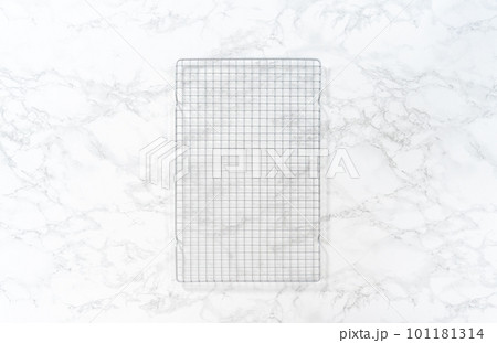 Empty baking drying rack on a marble surface. 101181314