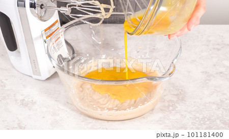 Step by step. Mixing ingredients to bake unicorn rainbow chocolate cupcakes. 101181400