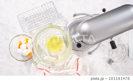 Flat lay. Step by step. Mixing ingredients in kitchen mixer to bake unicorn meringue pops cookies. Flat lay. Step by step. Mixing ingredients in kitchen mixer to bake unicorn meringue pops cookies. 101181478