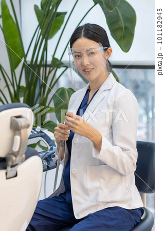 female scientist looking at the tube, dental,doctor dentist woring 101182943