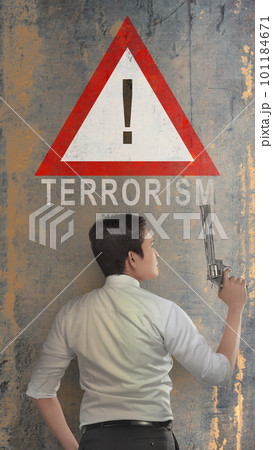 Rear view of a businessman holding gun with a stop terrorism sign 101184671