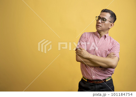 Man with eyeglasses and a shirt standing 101184754